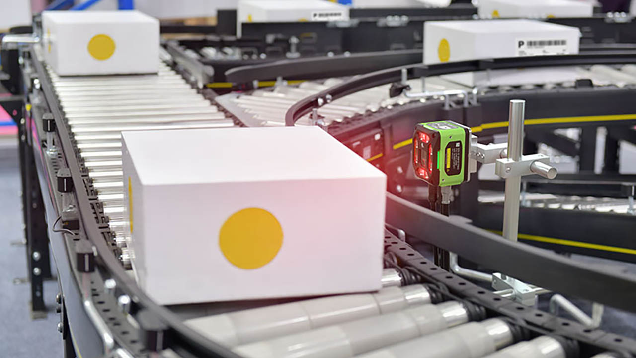 Warehouse White boxes on a warehouse conveyor belt system with a scanner. Warehouse equipment installation tips for efficiency.