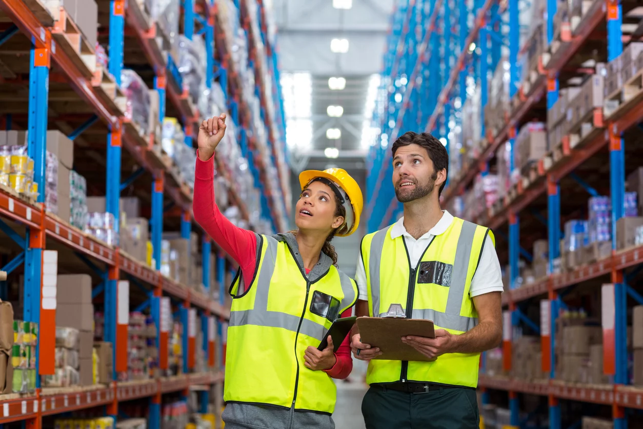 Warehouse Detailed Material Handling Design for increased efficiency and safety, as observed by workers in a structured warehouse.